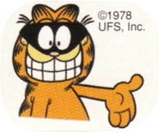 Garfield the cartoon cat relaxing inside a jack o’ lantern, smiling at the viewer and wearing the top of the pumpkin as a hat.